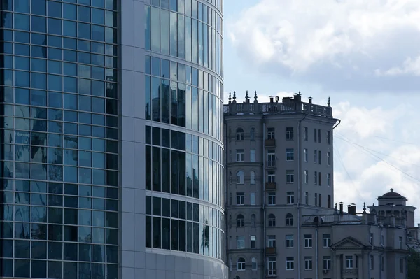 stock image Reflection of a cloudy sky in glass wall of an office building