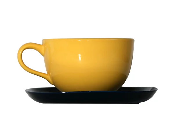 Large yellow cup and black saucer isolated on white — Stock Photo, Image