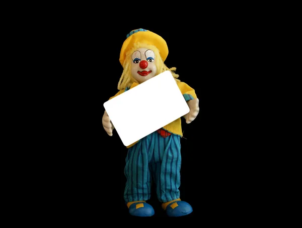 La statuetta isolata del clown con una carta di credito vuota in mano — Foto Stock