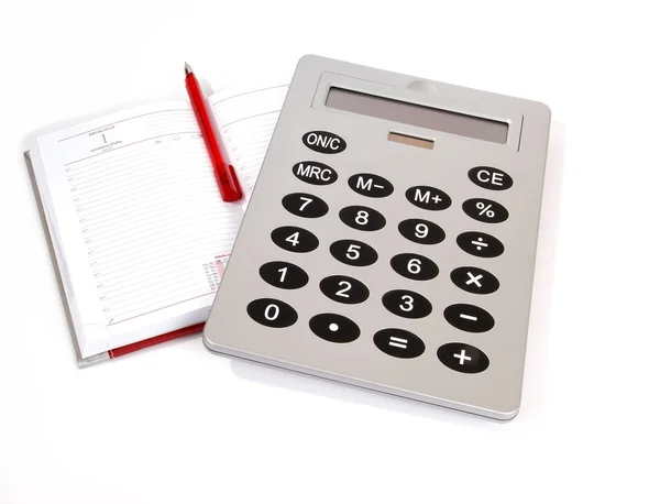 Grande calculadora e notebook para referência notas diárias com uma caneta em um whi — Fotografia de Stock