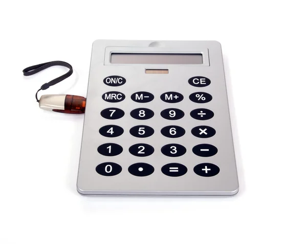 Uma grande calculadora com unidade flash USB no fundo branco — Fotografia de Stock