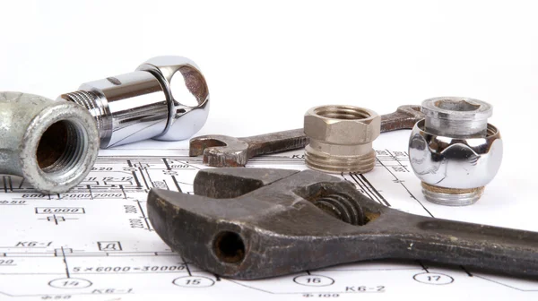 Blueprint and plumbing supplies, closeup — Stock Photo, Image