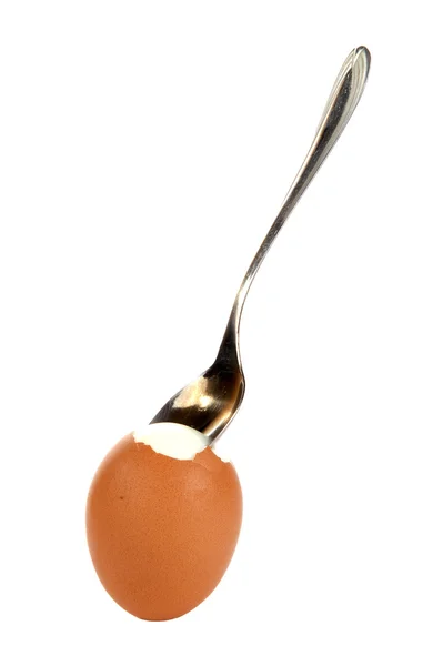 Egg with a small spoon, isolated on a white background — Stock Photo, Image