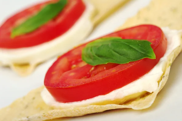 Appetizer: Tomato, Mozzarella and Basil on Crocantini — Stock Photo, Image