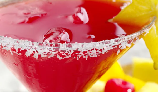 Red Cocktail Ice Cubes Grated Coconut Carambola Glass Rim Fruits — Stock Photo, Image