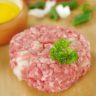 Raw Meatball Garnished with Parsley clipart