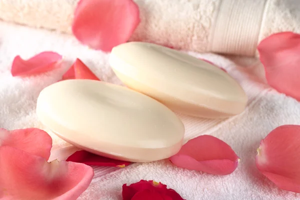 Two Soap Bars on Towels with Rose Petals — Stock Photo, Image