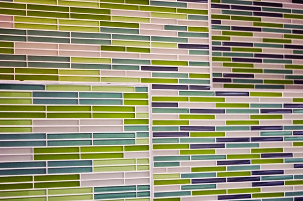 stock image Green and blue blocks form patterned wall