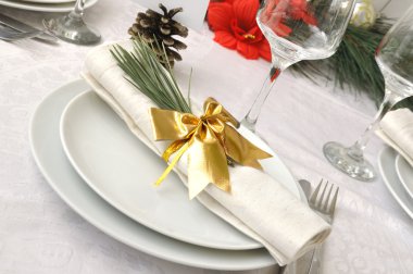 Coordinated decorative napkin on a plate with cutlery clipart