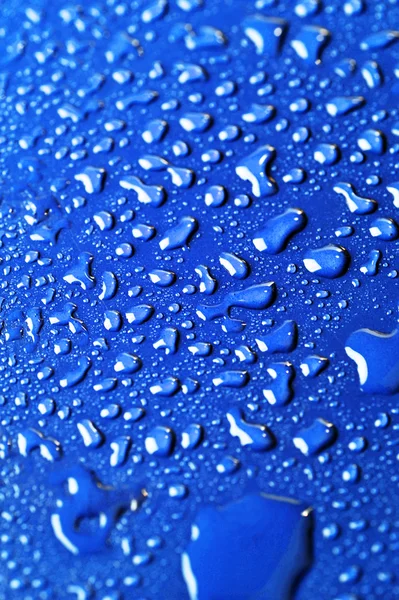 Water drops on color background — Stock Photo, Image