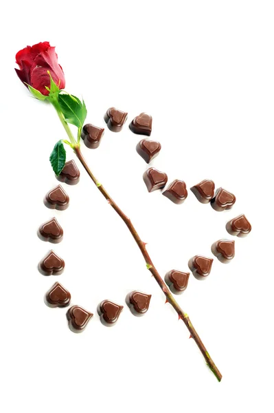Čokoládové bonbony a růže — Stock fotografie