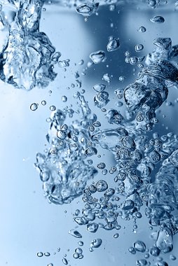 Bubbles in a blue water close up clipart