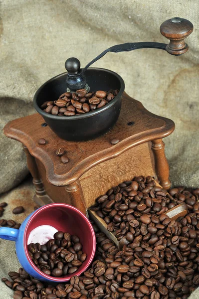 Coffee grinder and cup — Stock Photo, Image