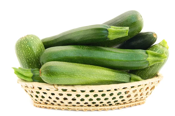 Fresh small green vegetable marrows in a basket — Stock Photo, Image