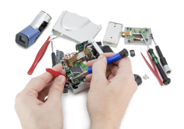 Repair of a digital video camera clipart