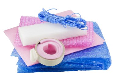 Soft packing material kit - film, foam rubber, sticky tape, rope. Isolated on white, with patch clipart