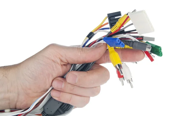 Hand houdt set kabels met connectoren — Stockfoto