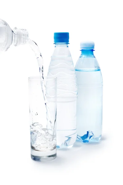 Drinking water in the glass and bottles — Stock Photo, Image