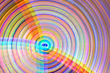 Abstract rainbow colored background in the shape of circles clipart