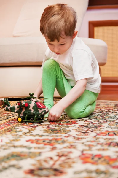 Little boy with toy helicopter — Stock Photo, Image