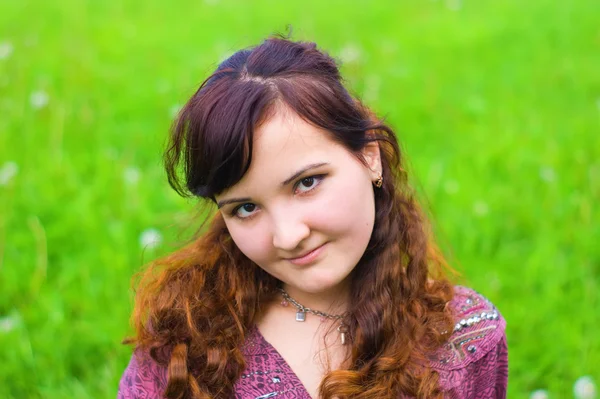 stock image Young woman on grass