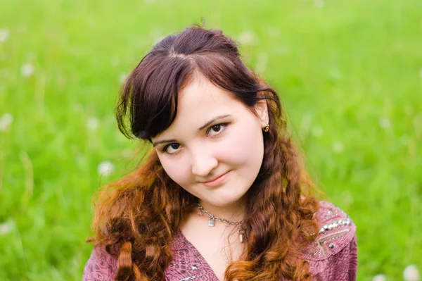 stock image Young woman on grass