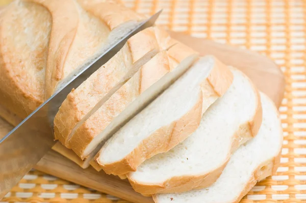 stock image Bread cutting to slices