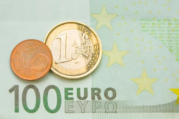 One euro, one cent on one hundred euro bill — Stock Photo, Image