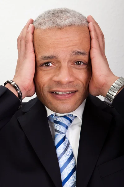 Uomo d'affari stressato con mal di testa — Foto Stock