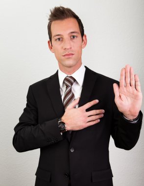 Businessman Taking Oath clipart