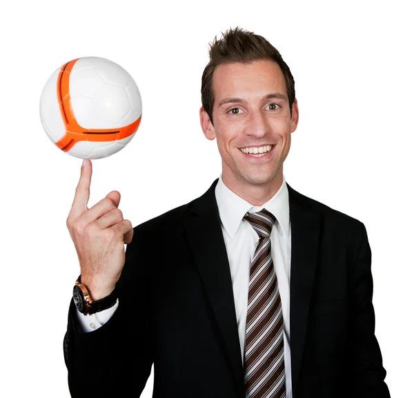 Businessman spinning soccer ball — Stock Photo, Image