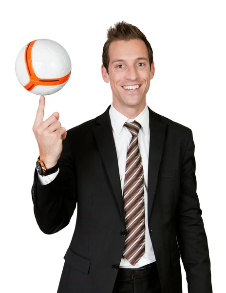 Businessman spinning soccer ball — Stock Photo, Image