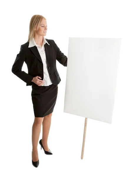 Mujeres de negocios alegres presentando tablero vacío —  Fotos de Stock
