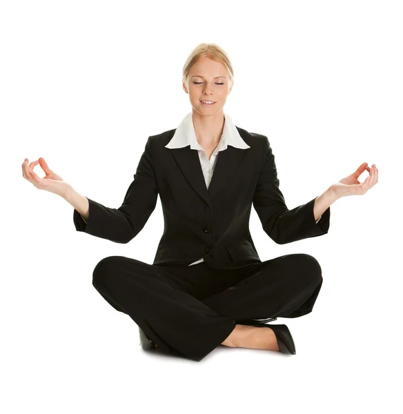 Businesswoman sitting in lotus flower position — Stock Photo, Image