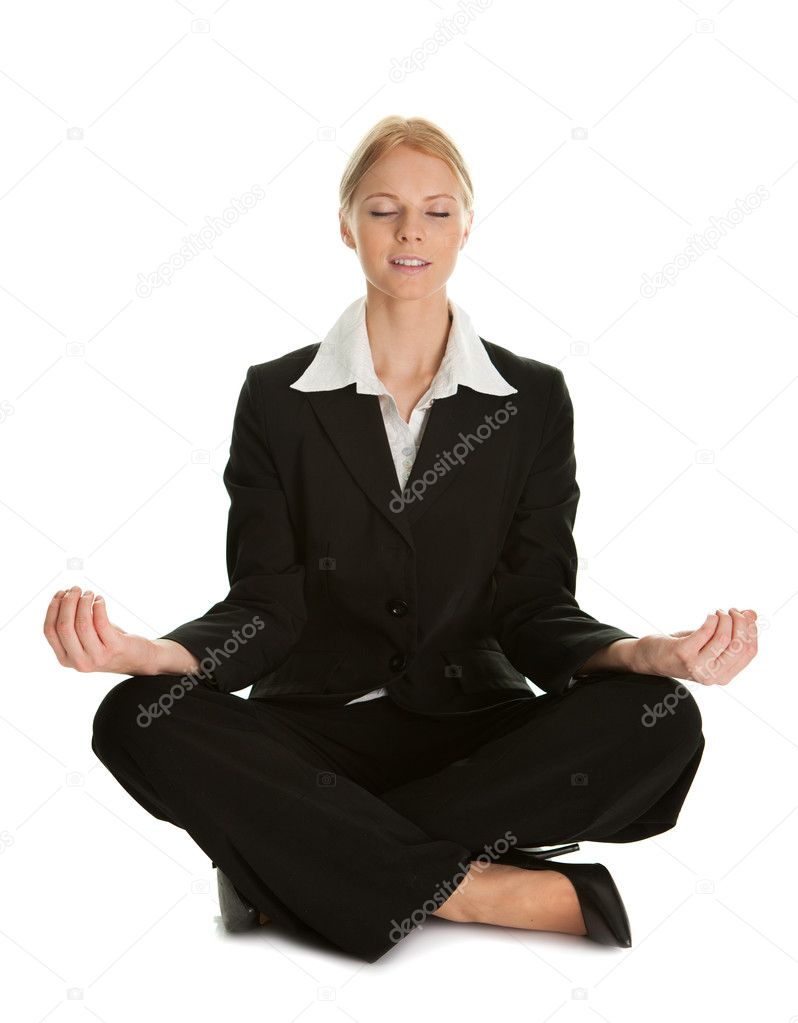 Businesswoman sitting in lotus flower position of yoga. Isolated on white