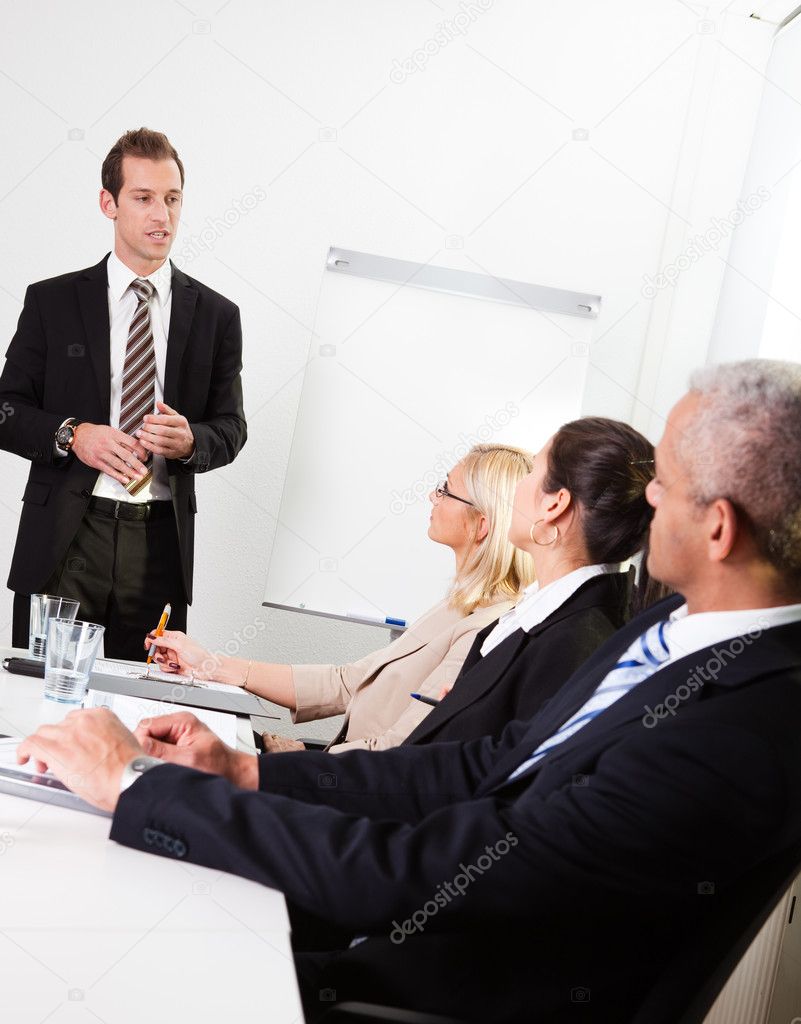 Businessman giving a presentation to his colleagues