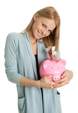 Beautiful woman holding her personal savings in piggy bank. Isolated clipart