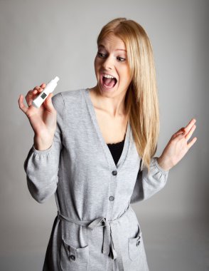 Beautiful young woman scared of pregnancy test results clipart