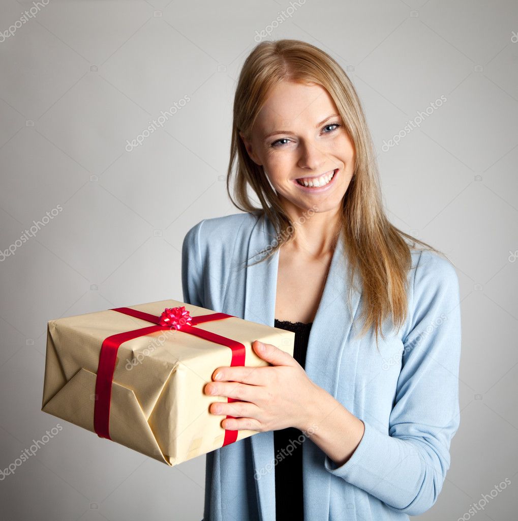 Happy Woman Holding Gift Box — Stock Photo © AndreyPopov #4906512