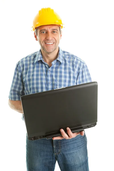 Trabajador con sombrero duro y usando leptop — Foto de Stock