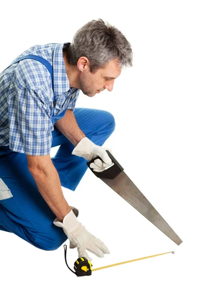 Confident service cutting with saw — Stock Photo, Image