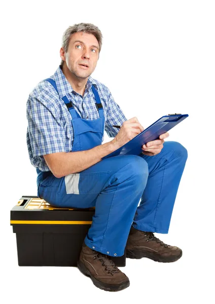 Confident service man taking notes — Stock Photo, Image