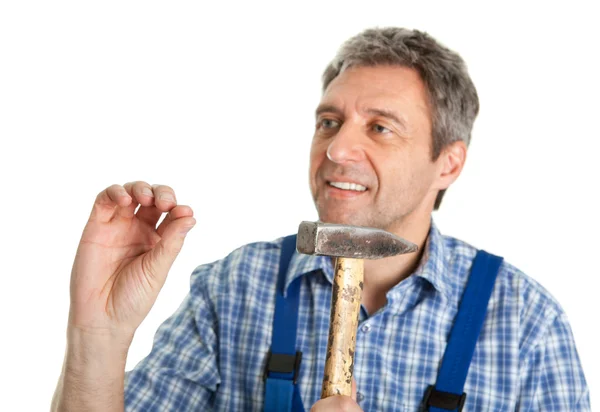 Confident service hammering in — Stock Photo, Image