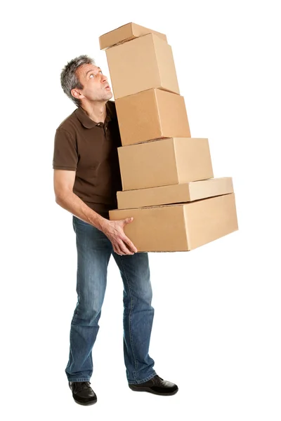 Entrega homem balanceamento pilha de caixas — Fotografia de Stock