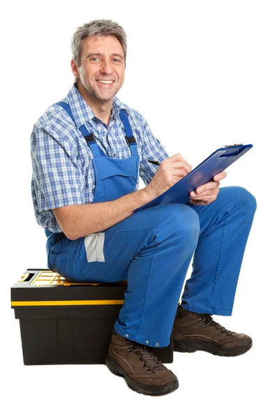 Confident service man taking notes — Stock Photo, Image