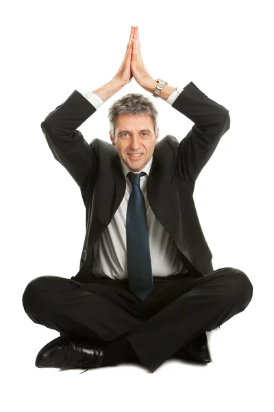 Zakenman zitten in yoga positie — Stockfoto
