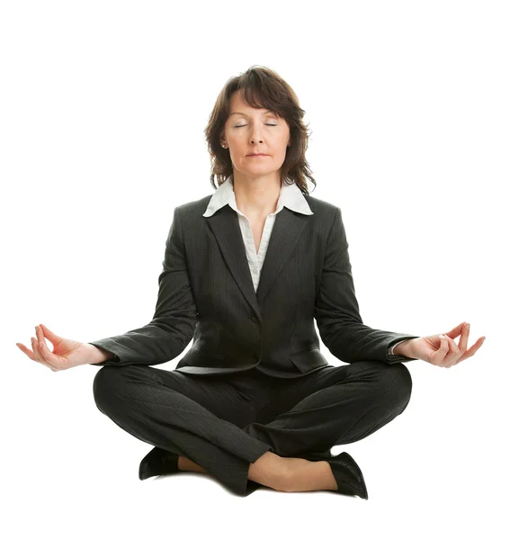 Businesswoman sitting in lotus position — Stock Photo, Image