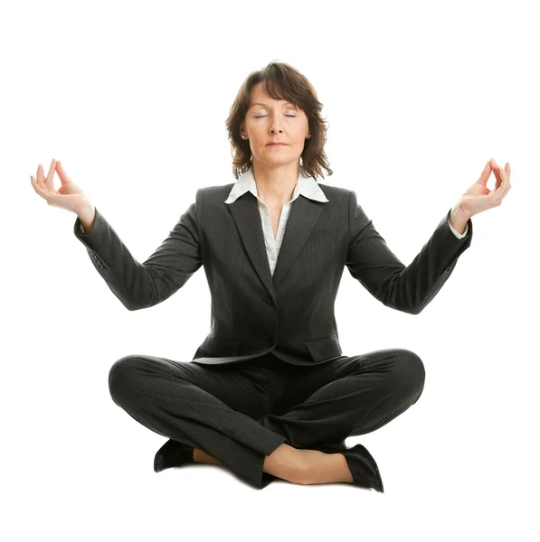 Businesswoman sitting in lotus position — Stock Photo, Image