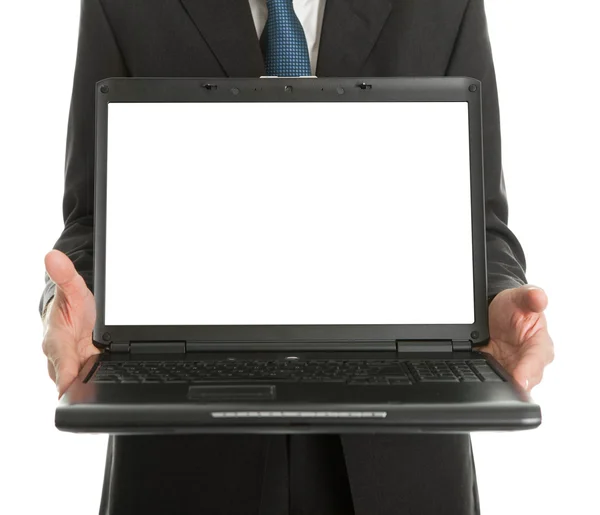 Primer plano del hombre de negocios que presenta laptopn Imagen de archivo