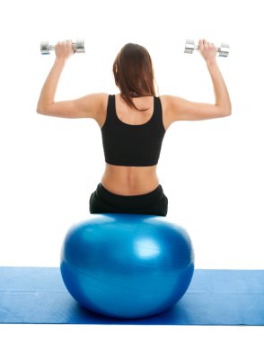 Fitness women doing weightlifting on fitness ball clipart